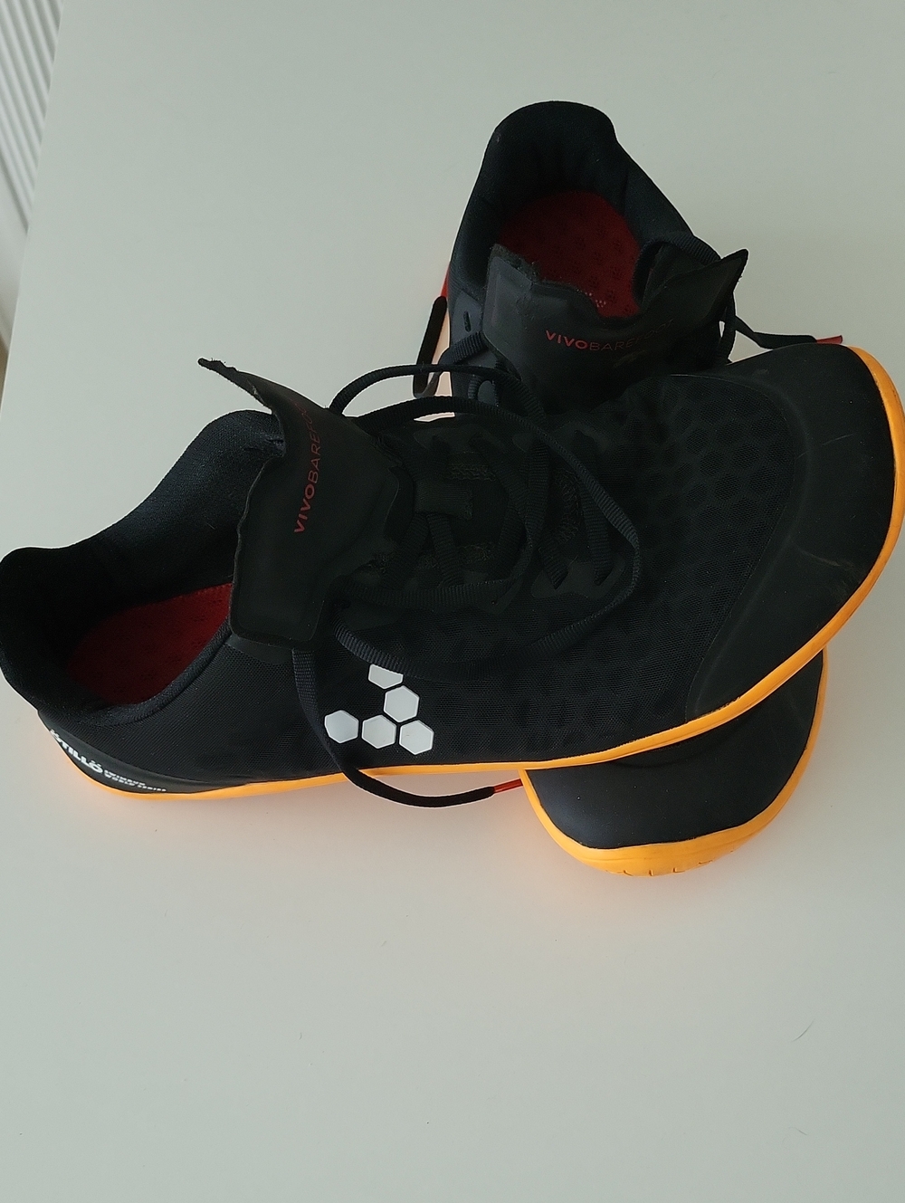Vivo barefoot Men’s Black Athletic Shoes with Orange Sole